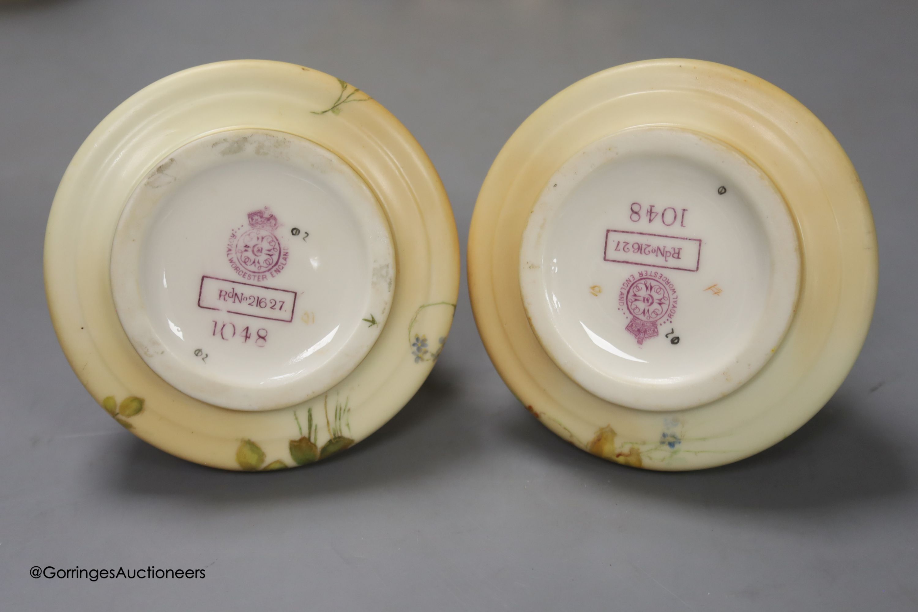 A Royal Worcester blush leaf dish, a pair of ewers, a two handled vase and another